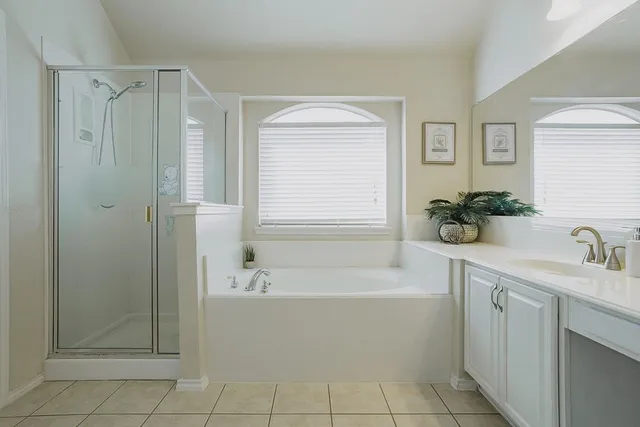 a bathroom with a bathtub and a sink