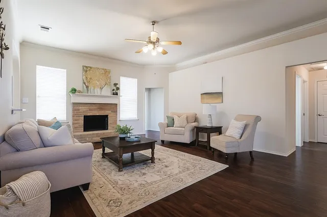 a living room with furniture and a fireplace