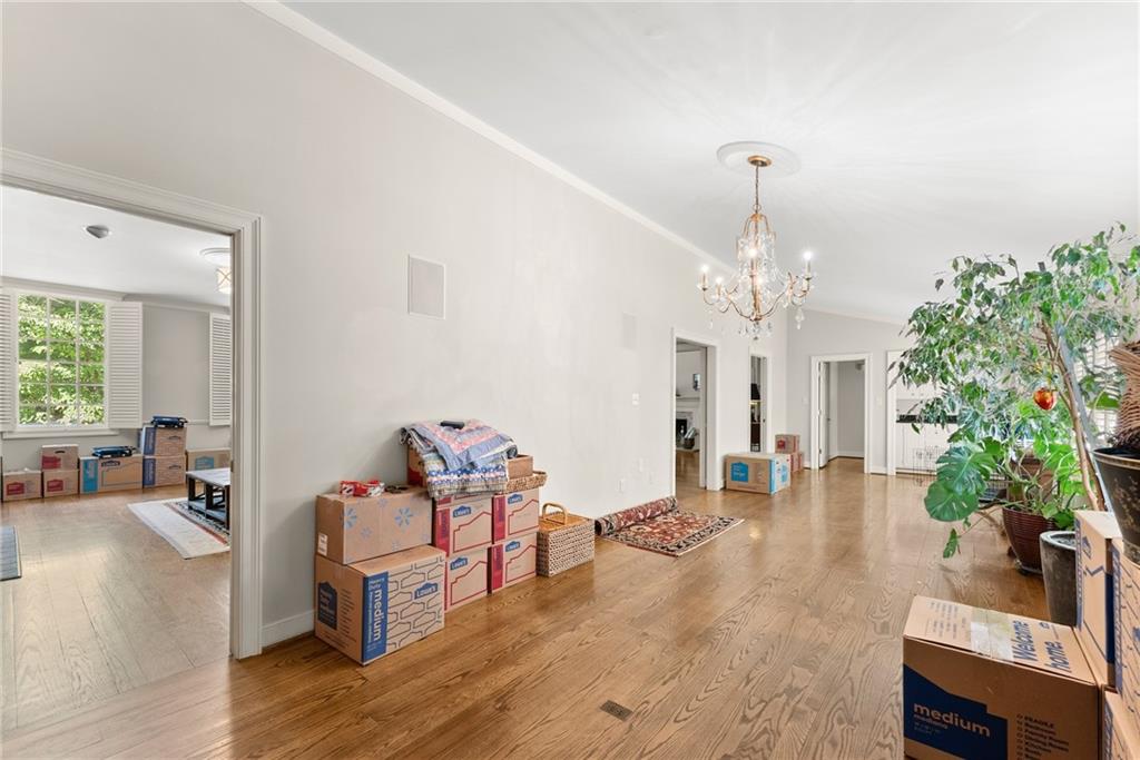 1885 Lake Warner Road Gainesville, GA 30501 - Photo 14 of 67 a living room with furniture a chandelier and a dining room