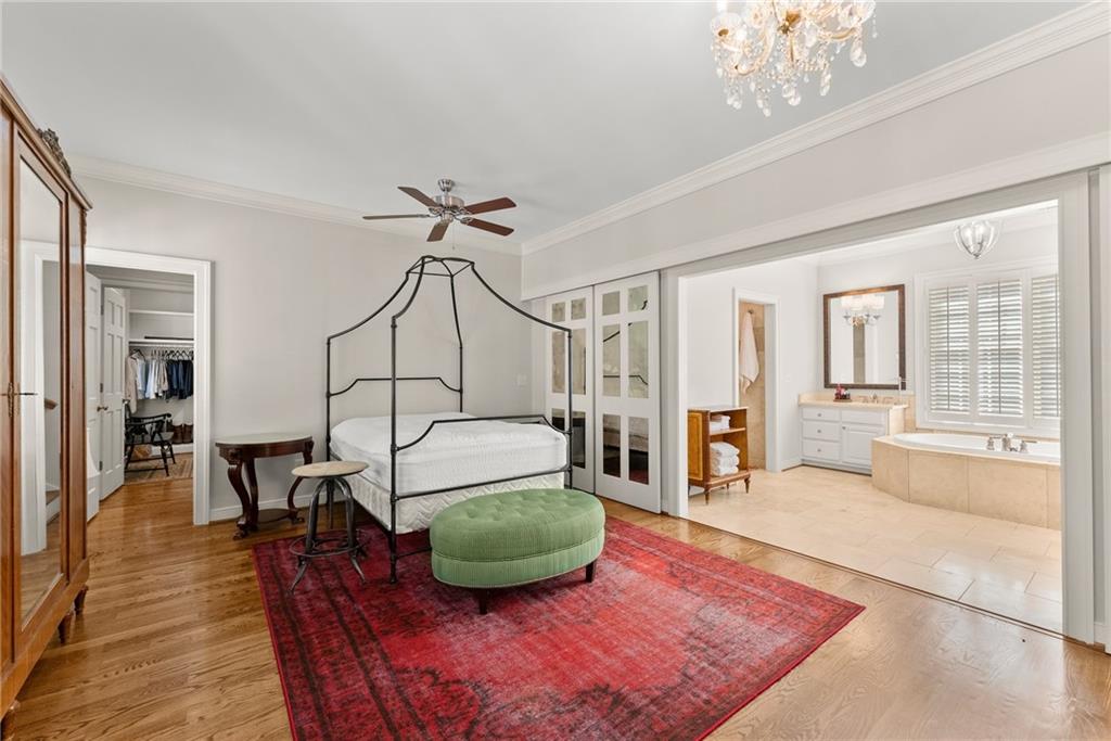 1885 Lake Warner Road Gainesville, GA 30501 - Photo 15 of 67 a living room with furniture a dining table and a chandelier
