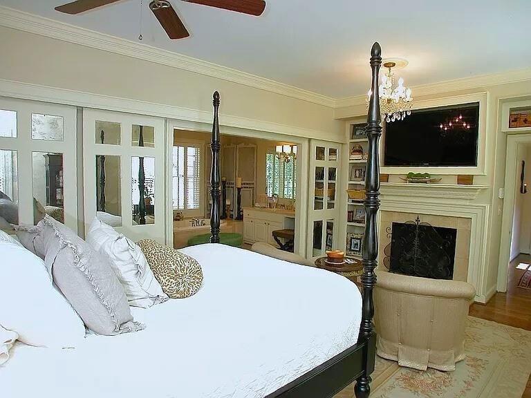 1885 Lake Warner Road Gainesville, GA 30501 - Photo 16 of 67 a spacious bedroom with a bed and a flat screen tv