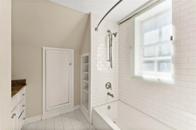 a view of a bedroom with wooden floor and stairs