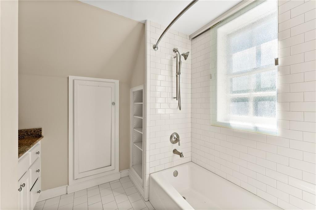 1885 Lake Warner Road Gainesville, GA 30501 - Photo 26 of 67 a bathroom with a bathtub and shower