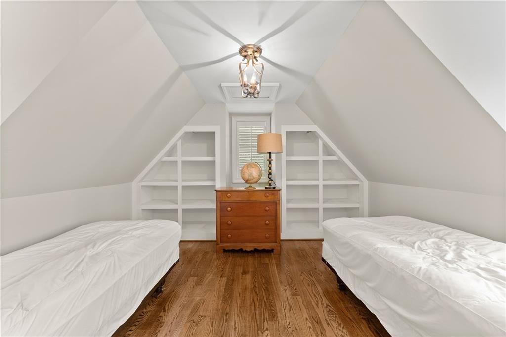 1885 Lake Warner Road Gainesville, GA 30501 - Photo 35 of 67 a view of a bedroom with wooden floor and stairs