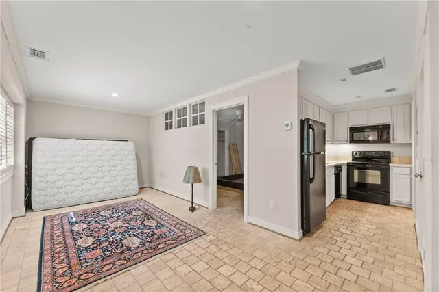 a view of a house with a tree and a yard