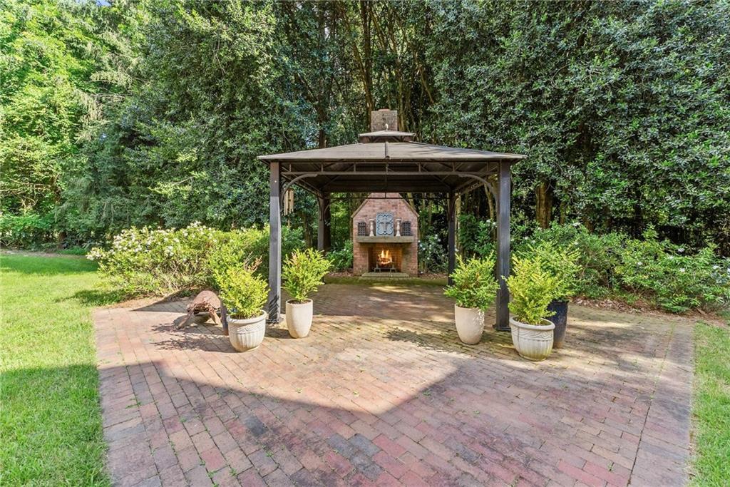 1885 Lake Warner Road Gainesville, GA 30501 - Photo 44 of 67 a view of a entrance gate of the house and trees