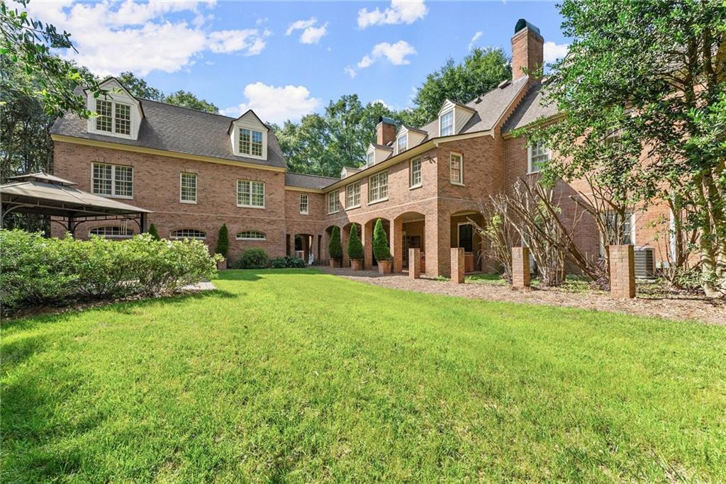 1885 Lake Warner Road Gainesville, GA 30501 - Photo 46 of 67 a view of a house with a yard