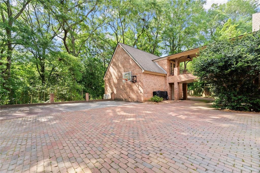1885 Lake Warner Road Gainesville, GA 30501 - Photo 48 of 67 a view of a house with a tree and a yard