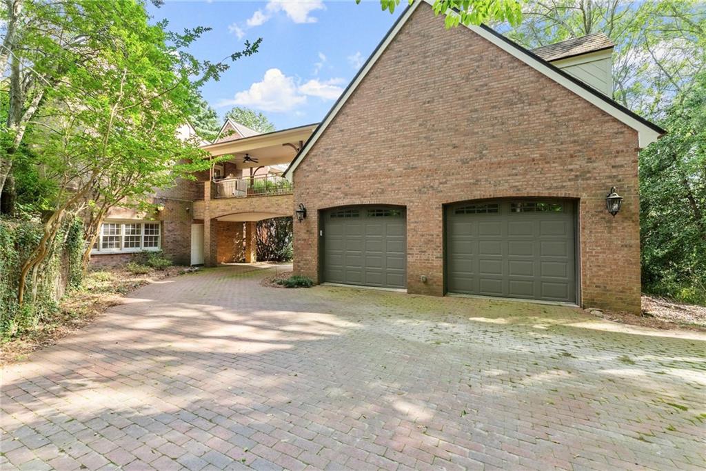 1885 Lake Warner Road Gainesville, GA 30501 - Photo 49 of 67 a front view of a house with a yard and garage