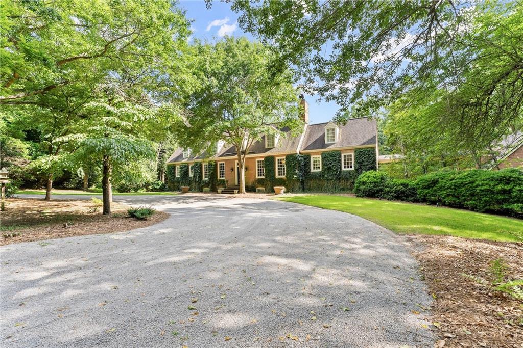 1885 Lake Warner Road Gainesville, GA 30501 - Photo 51 of 67 a view of a house with a yard and large trees
