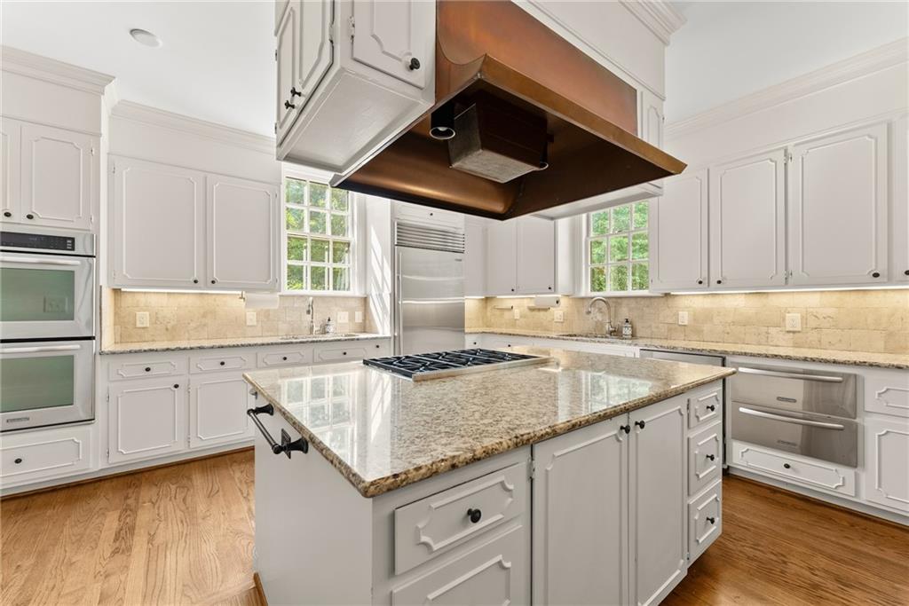 1885 Lake Warner Road Gainesville, GA 30501 - Photo 9 of 67 a kitchen with granite countertop a sink stove and cabinets