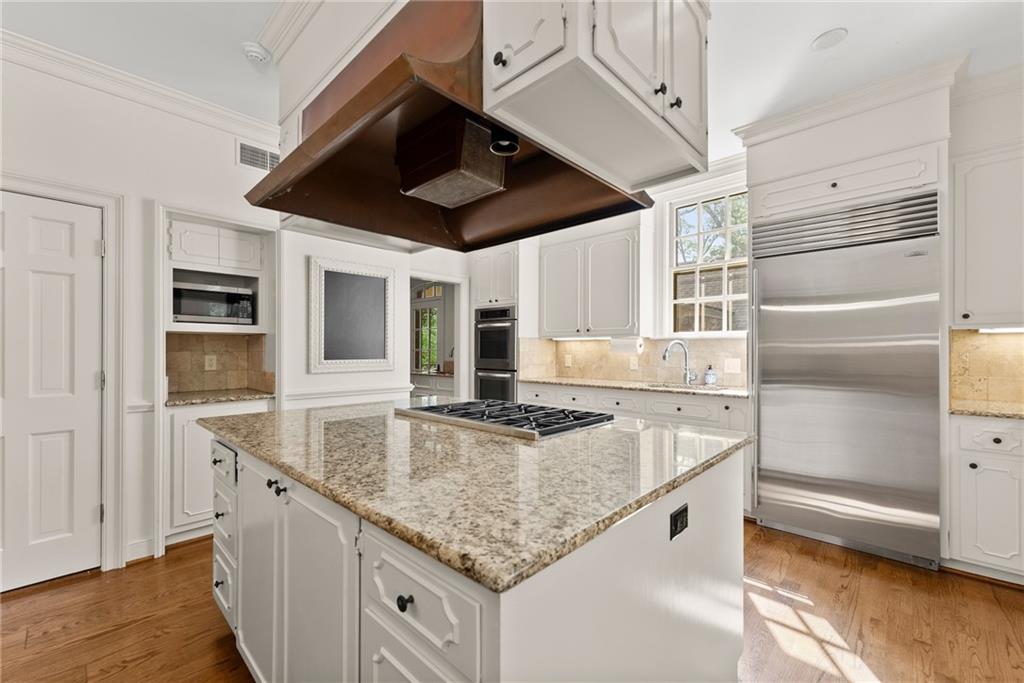 1885 Lake Warner Road Gainesville, GA 30501 - Photo 10 of 67 a kitchen with stainless steel appliances granite countertop a sink and a refrigerator