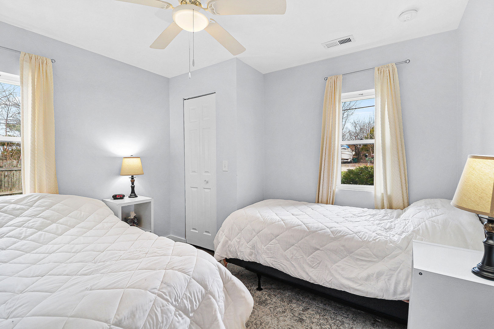 502 Monroe Avenue Ingleside, IL 60041 - Photo 14 of 20 a bedroom with a bed and a chandelier