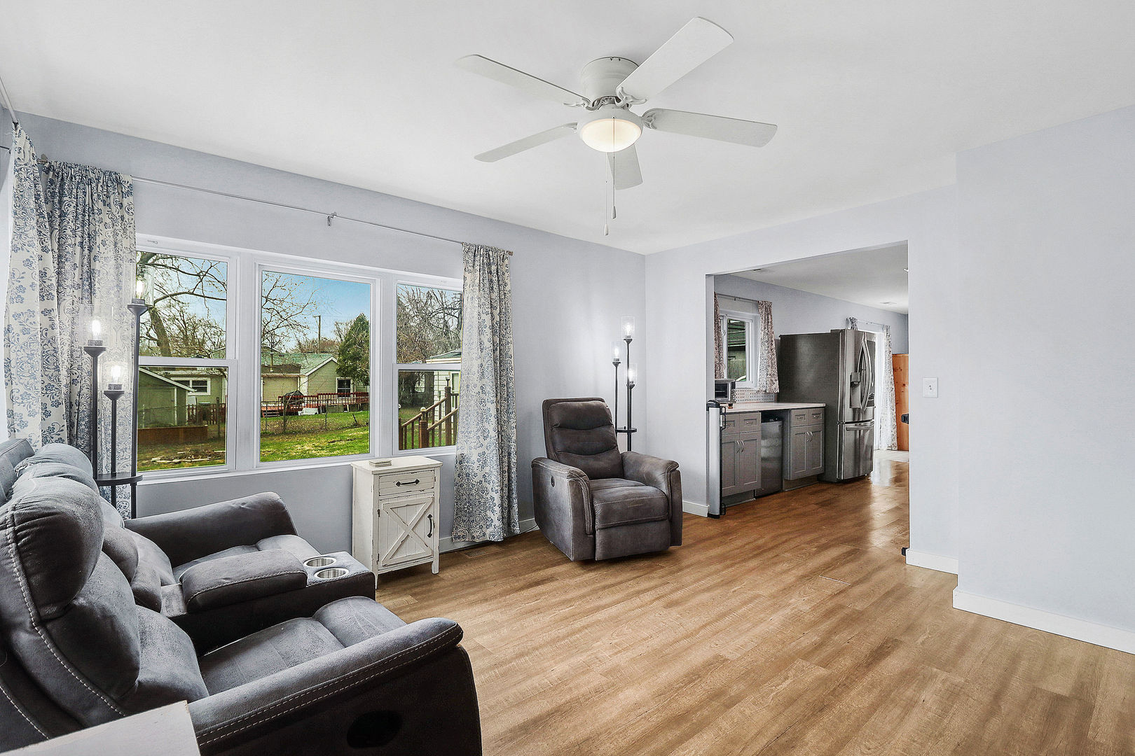 502 Monroe Avenue Ingleside, IL 60041 - Photo 3 of 20 a living room with furniture floor to ceiling window and a kitchen view