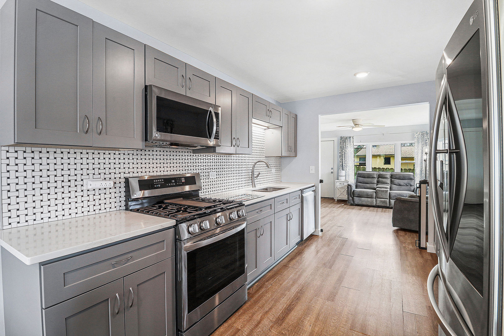 502 Monroe Avenue Ingleside, IL 60041 - Photo 6 of 20 a kitchen with stainless steel appliances a stove sink and microwave