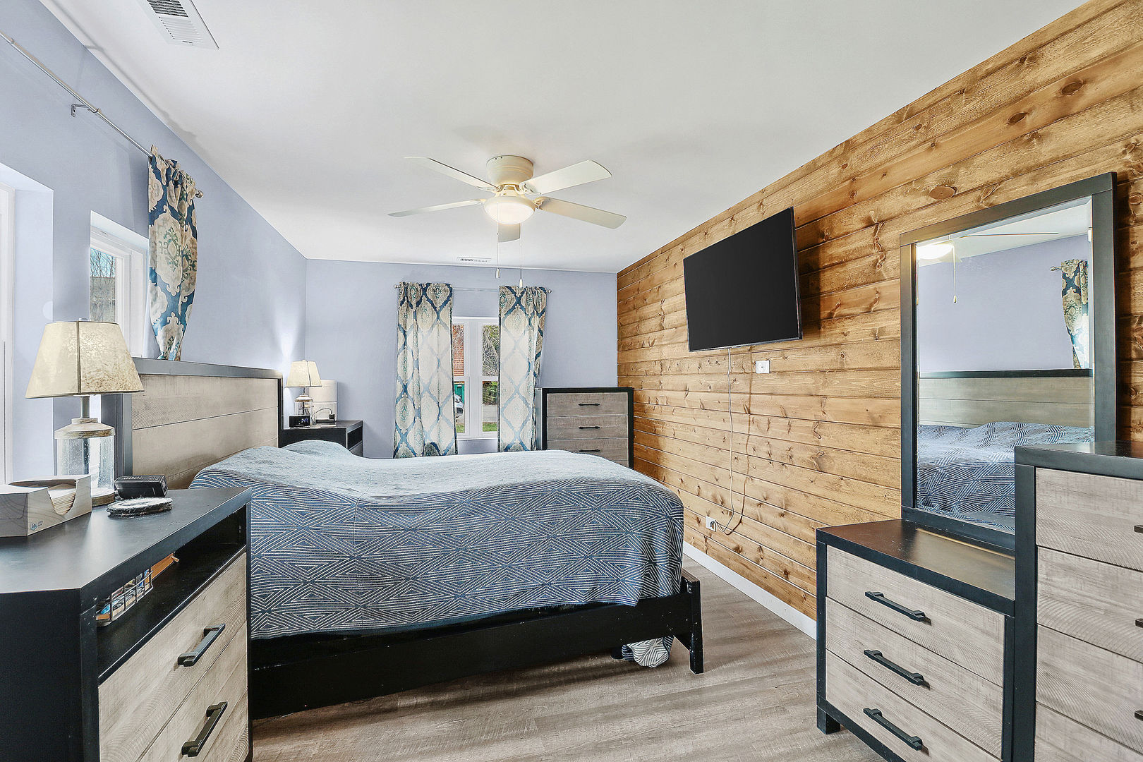 502 Monroe Avenue Ingleside, IL 60041 - Photo 9 of 20 a bedroom with a bed and a flat screen tv