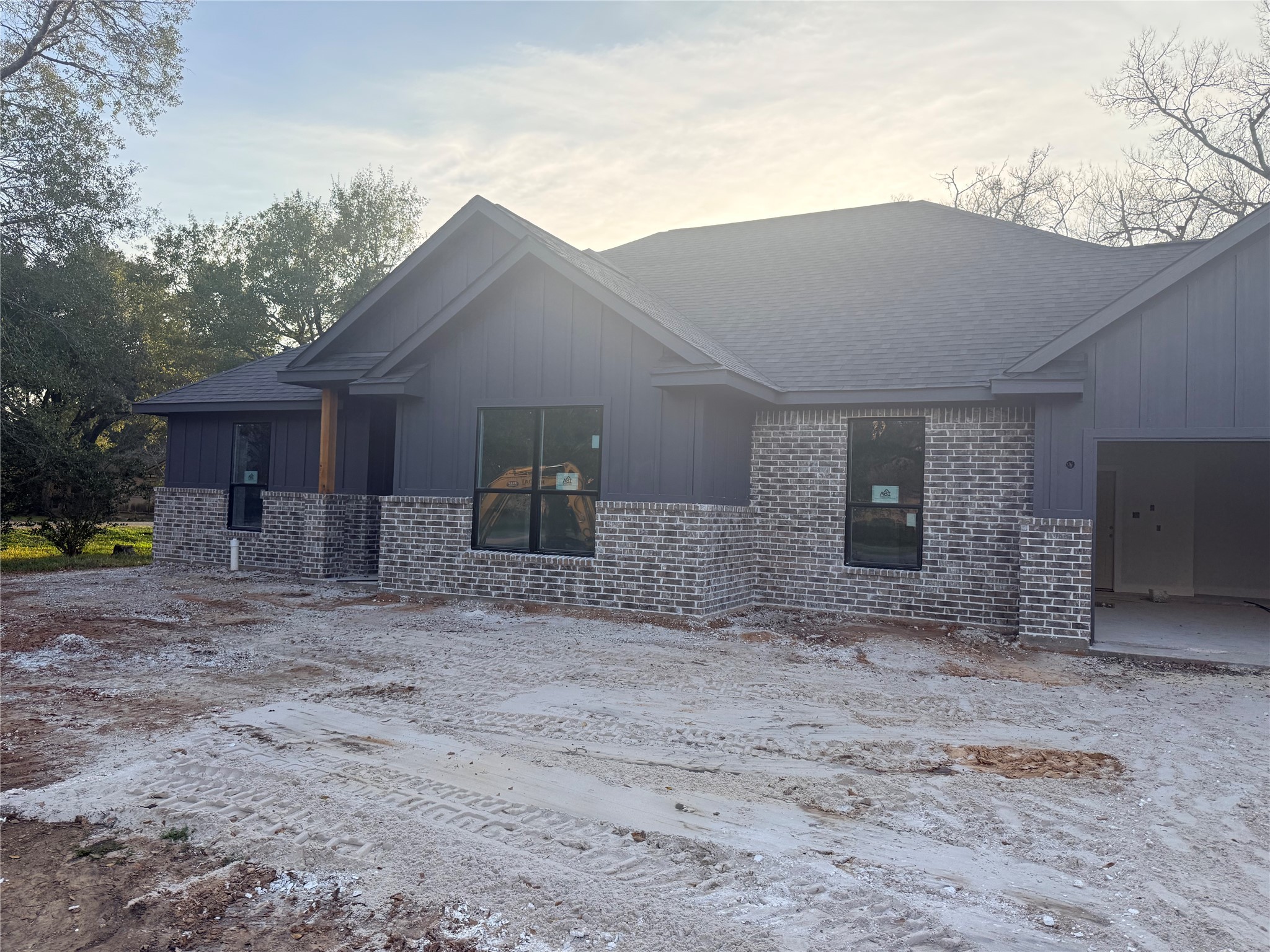 438 Old Wharton Road East Bernard, TX 77435 - Photo 2 of 6 a front view of a house with a yard and garage