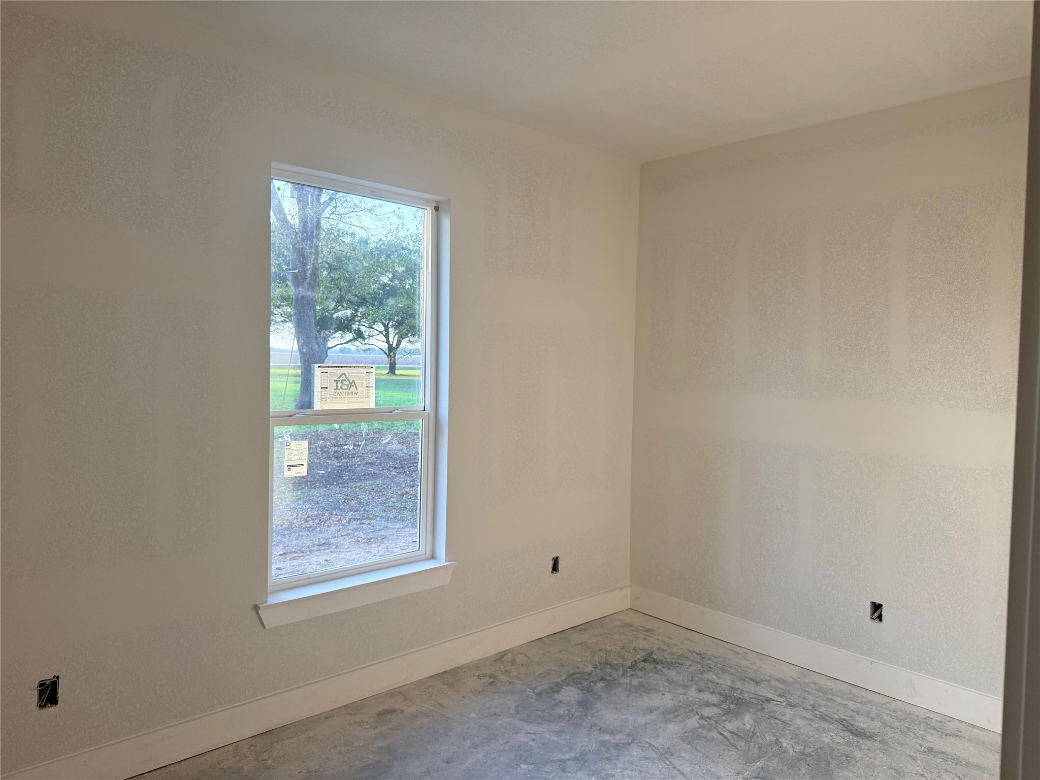 438 Old Wharton Road East Bernard, TX 77435 - Photo 6 of 6 an empty room with windows