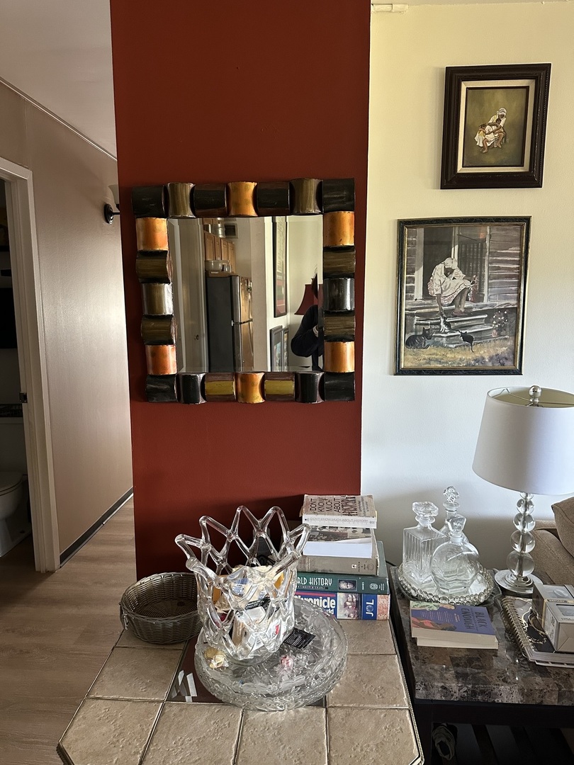 4850 South Lake Park Avenue, Unit 702B Chicago, IL 60615 - Photo 12 of 13 a living room with furniture and painting on the wall