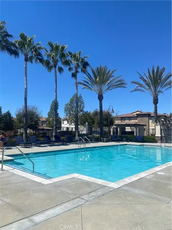a view of a swimming pool and a yard