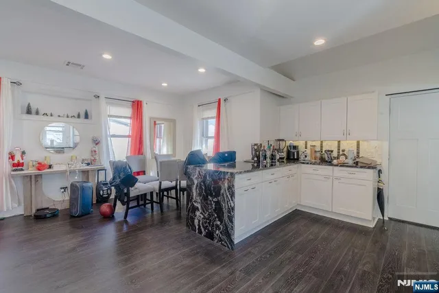 a bathroom with a sink mirror vanity and toilet
