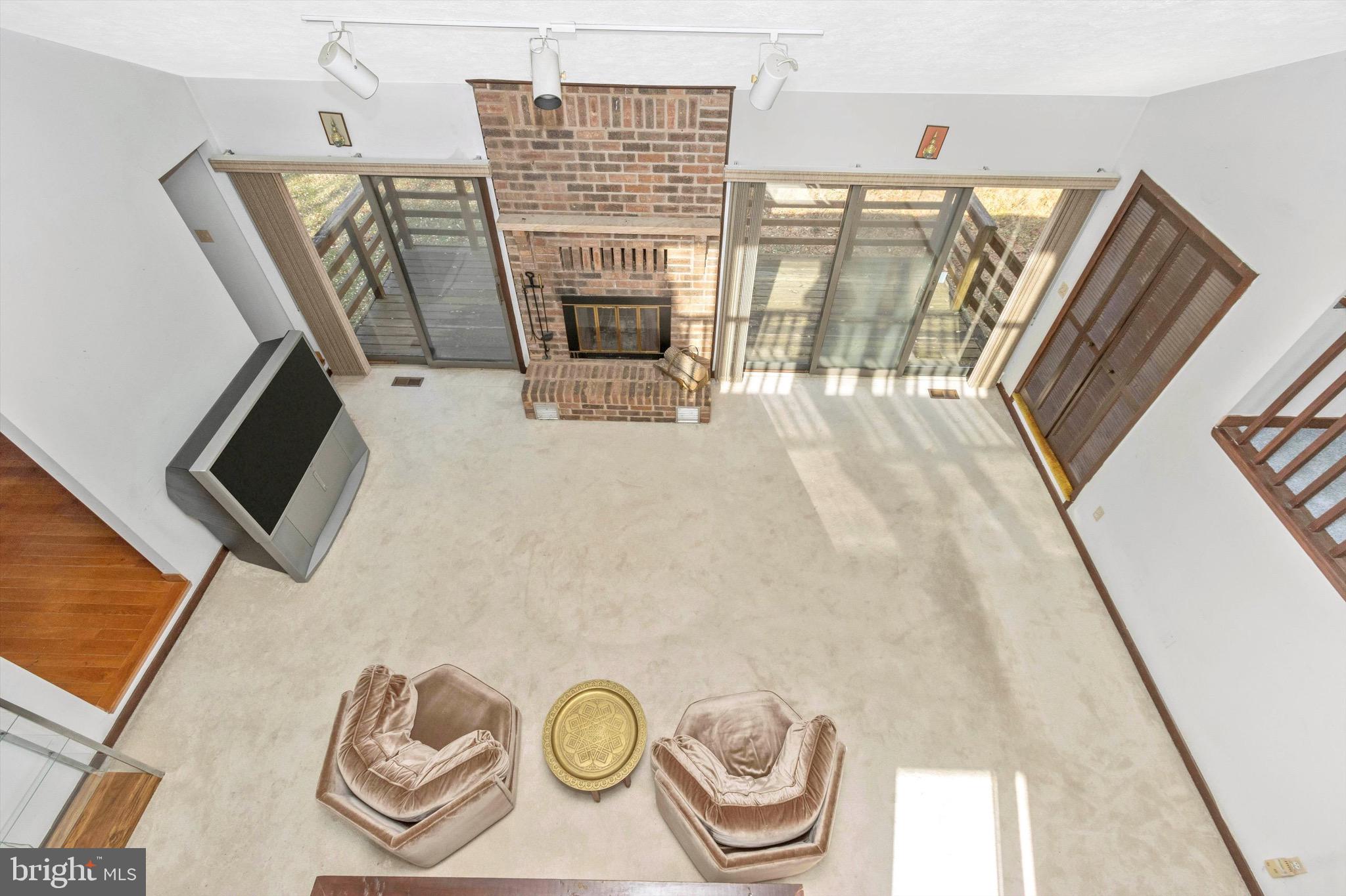 13248 Hunt Ridge Road Ellicott City, MD 21042 - Photo 7 of 57 Family room has 2 sliders to deck