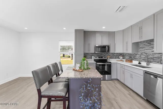 a kitchen with granite countertop lots of counter top space