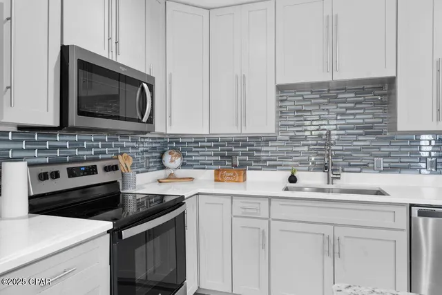 a view of a hallway with washer and dryer
