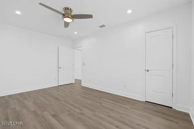 a bedroom with a bed and a desk