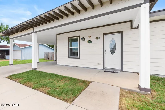 a view of a kitchen with a sink and cabinets