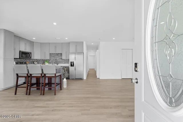a view of dining room with furniture and wooden floor