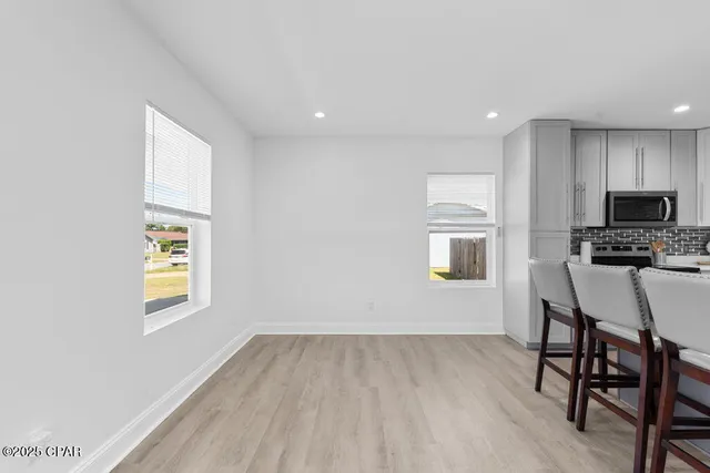 a kitchen with stainless steel appliances a sink stove and microwave