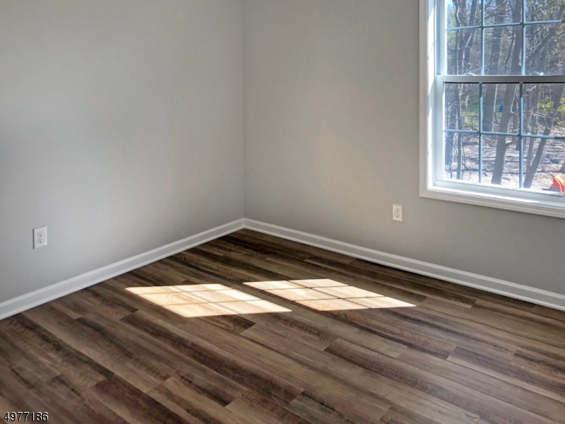 38 Old Shunpike Road, Unit B Randolph, NJ 07869 - Photo 15 of 18 a view of a room with wooden floor and fan