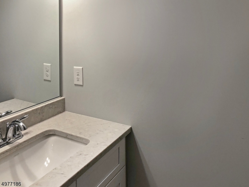 38 Old Shunpike Road, Unit B Randolph, NJ 07869 - Photo 7 of 18 a bathroom with a sink and vanity