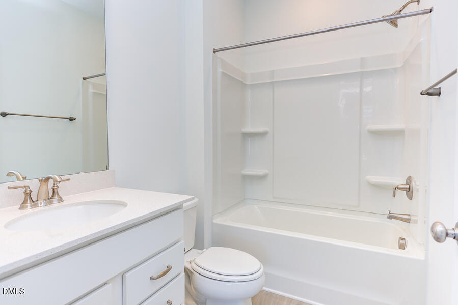 1949 Robin Hill Lane Raleigh, NC 27610 - Photo 27 of 39 a bathroom with a sink a toilet and a bathtub