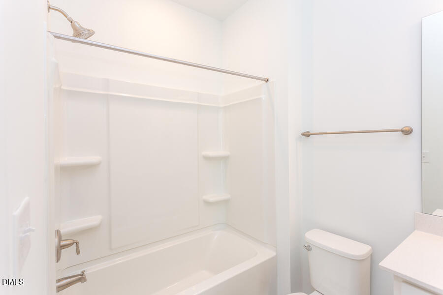 1949 Robin Hill Lane Raleigh, NC 27610 - Photo 33 of 39 a bathroom with a shower and a toilet