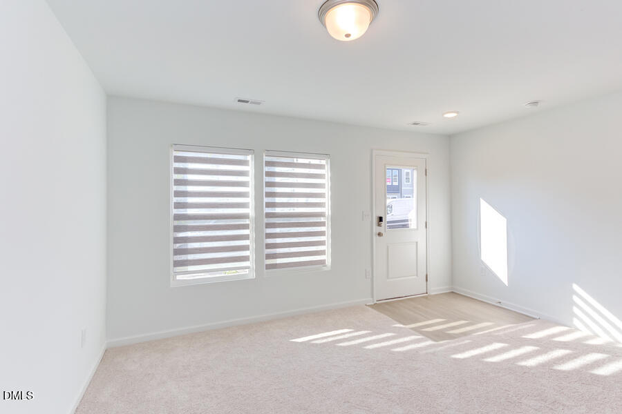1949 Robin Hill Lane Raleigh, NC 27610 - Photo 5 of 39 a view of an empty room with a window