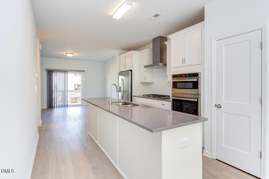 1949 Robin Hill Lane Raleigh, NC 27610 - Photo 8 of 39 a kitchen with stainless steel appliances a sink stove and cabinets