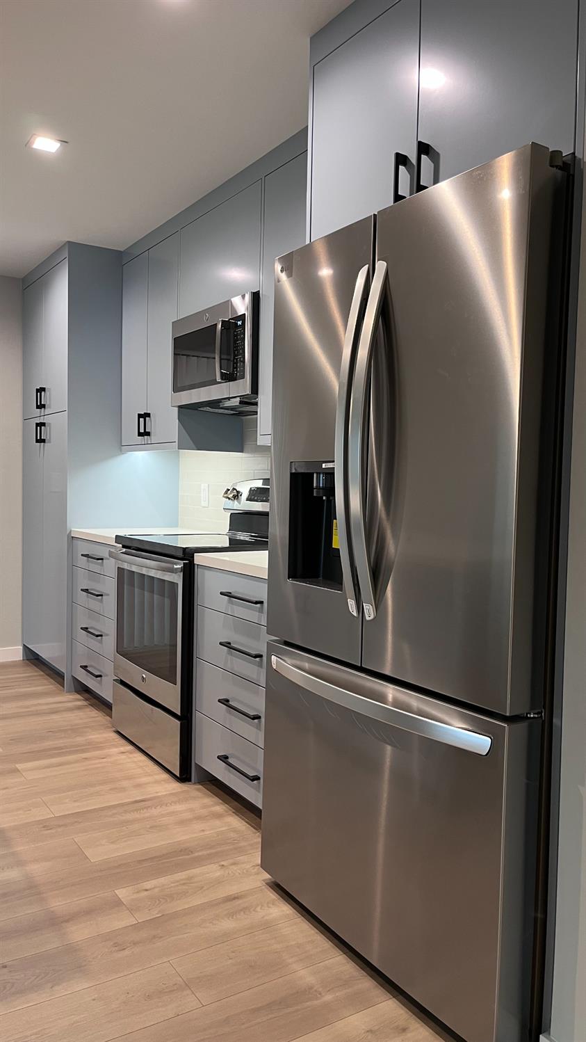 355 Sonoma Avenue Seaside, CA 93955 - Photo 16 of 32 a kitchen with stainless steel appliances granite countertop a refrigerator and a stove