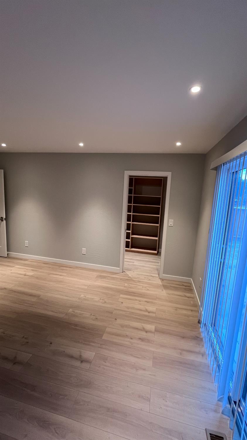 355 Sonoma Avenue Seaside, CA 93955 - Photo 8 of 32 a view of an empty room with wooden floor and stairs