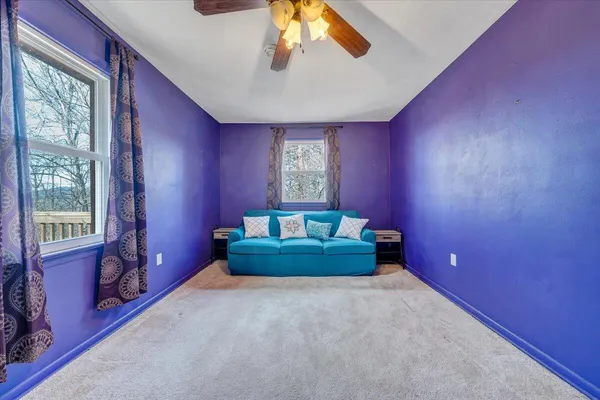 a spacious bedroom with a bed and window