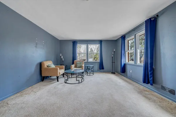 a living room with furniture and window