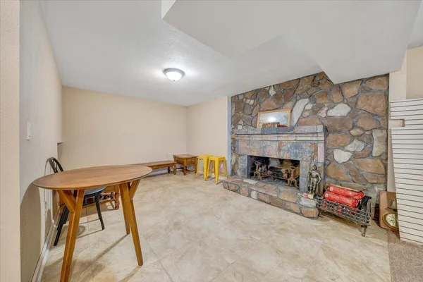 a livingroom with furniture and a fireplace