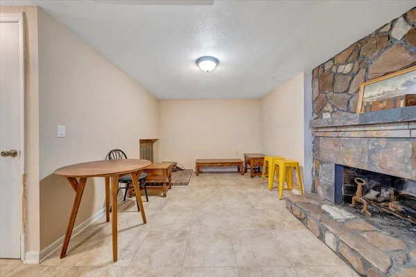 a view of a livingroom with furniture and a fireplace