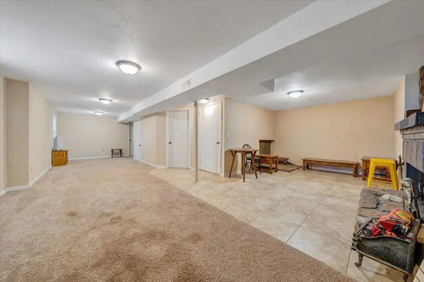 a view of a room with gym equipment and a large window