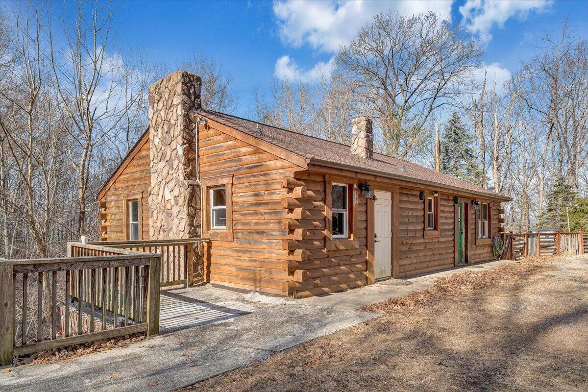 6847 Crowell Gap Road Boones Mill, VA 24065 - Photo 33 of 55 a front view of a house with a garage