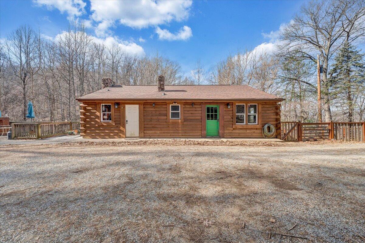 6847 Crowell Gap Road Boones Mill, VA 24065 - Photo 35 of 55 a front view of a house with a yard