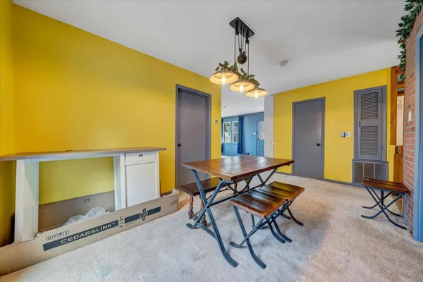 a view of a livingroom with furniture and a window