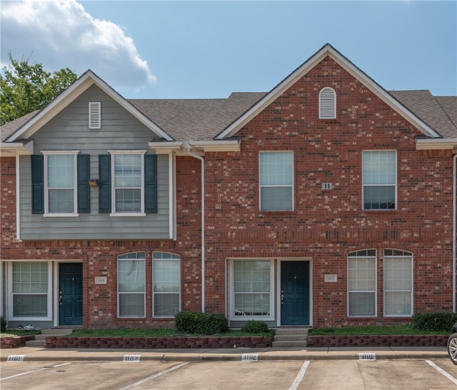 1001 Krenek Tap Road, Unit 1102 College Station, TX 77840 - Photo 1 of 26 a front view of a house with a yard and garage