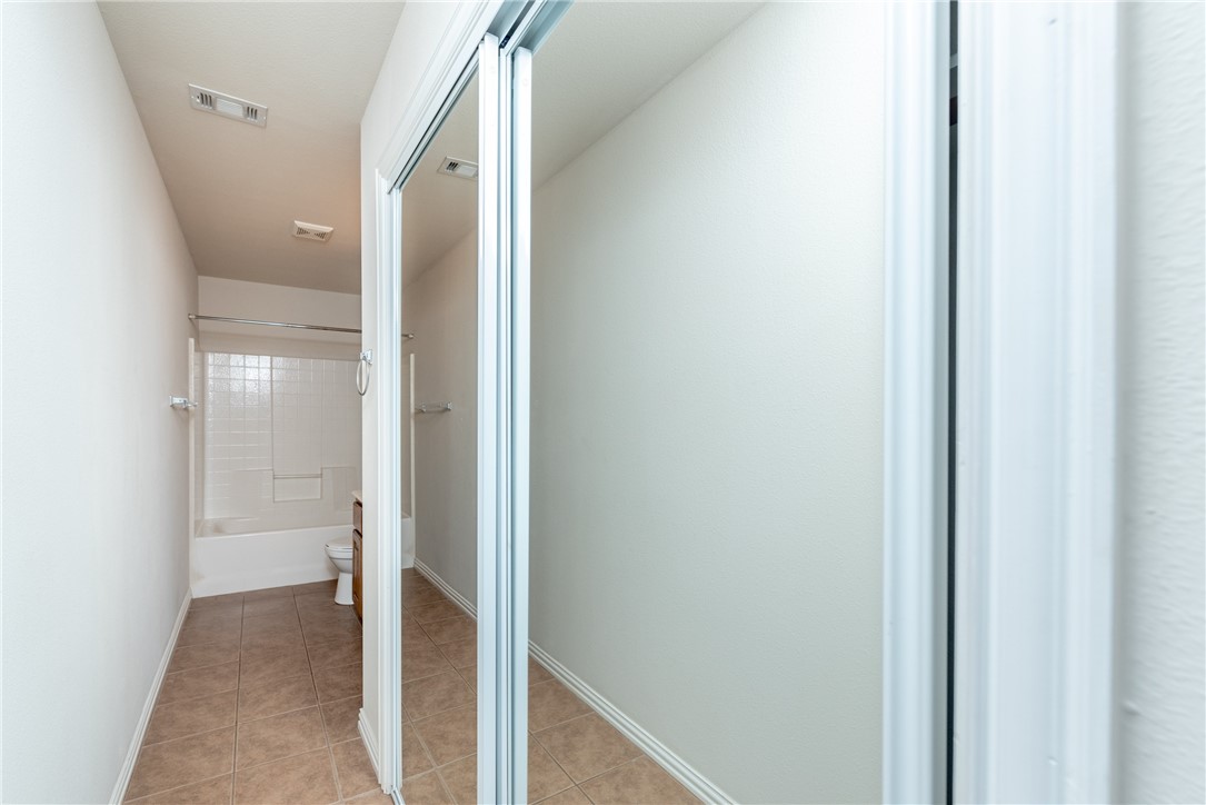 1001 Krenek Tap Road, Unit 1102 College Station, TX 77840 - Photo 13 of 26 a view of a hallway with wooden floor